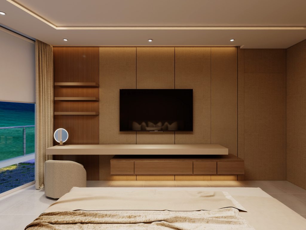 Luxury primary bedroom featuring custom walnut wall paneling, integrated headboard, warm ambient lighting, and floor-to-ceiling ocean views.